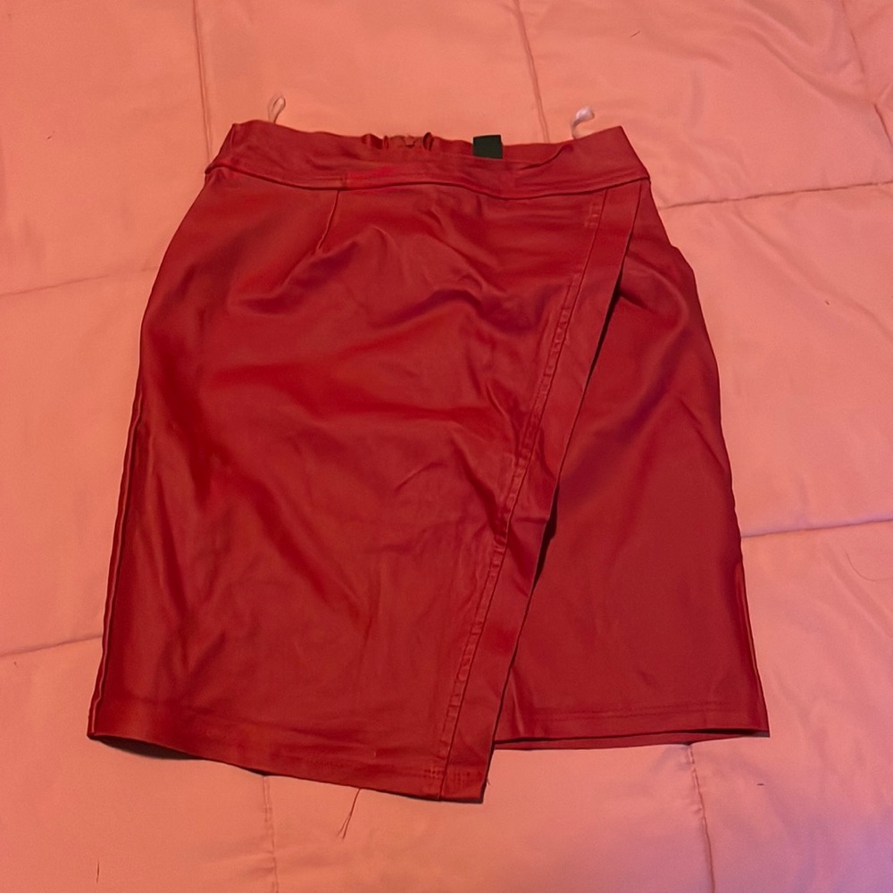 Red mini skirt with a slight asymmetrical cut. Size S!
